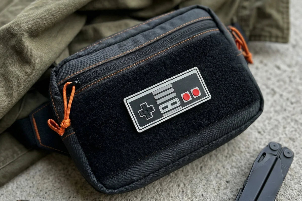 Black pouch with a Nintendo controller logo on a textured surface