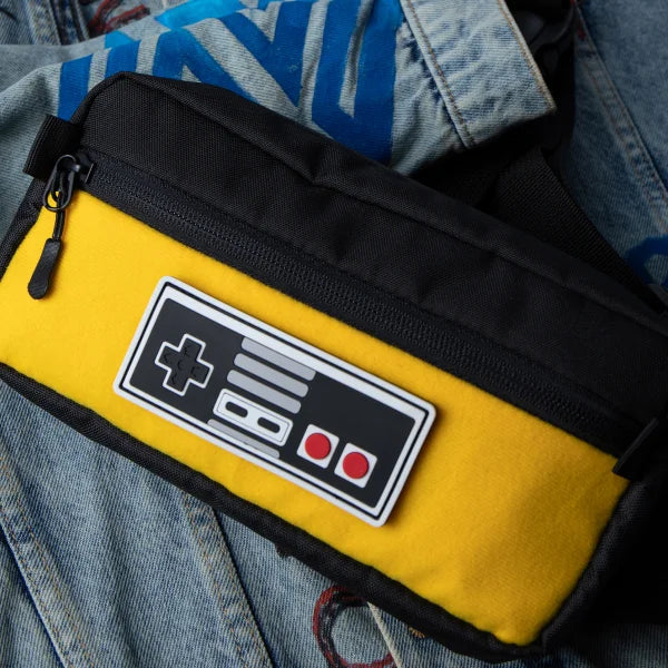 Yellow pouch with a controller design on denim fabric